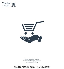 hand holding a shopping cart online store. icon. Vector Eps 10