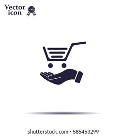 hand holding a shopping cart online store. icon. Vector Eps 10