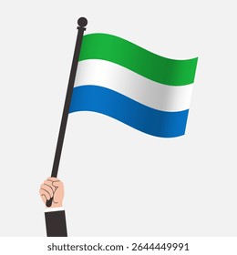 Mão segurando a bandeira de Serra Leoa