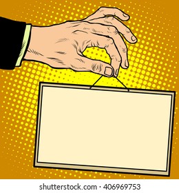 Hand holding a sign