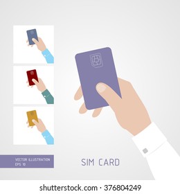 Hand holding SIM card. 