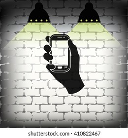 Hand holding smart phone.
