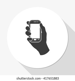 Hand holding smart phone.
