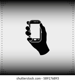 Hand holding smart phone.