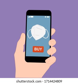 Hand holding smart phone with buy button on the screen. Contactless online purchase of goods using your phone. Use protective  n95 mask . Home delivery. Disease prevention concept.