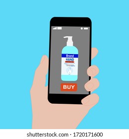 Hand holding smart phone with buy button on the screen. Contactless online purchase of goods using your phone. Use Hand Sanitizer. Alcohol gel pump bottle. Diseases prevention. Home delivery.