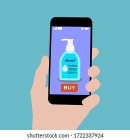 Hand holding smart phone with buy button on the screen. Contactless online purchase of goods using your phone. Use Hand wash soap pump bottle. Diseases prevention. Home deliVery.