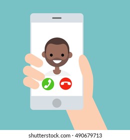 Hand holding a smart phone. Incoming call from young black boy/ flat vector illustration