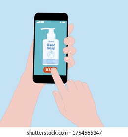 Hand holding smart phone and press buy button on the screen. Contactless online purchase of goods using your phone. Use Hand sanitizer. Diseases Wireless Technology. Home delivery.