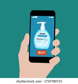 Hand holding smart phone and pressing buy button on the screen. Contactless online purchase of goods using your phone. Use Hand Soap pump bottle. Wireless technology. Home delivery.