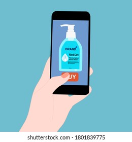 Hand holding smart phone and pressing buy button on the screen. Contactless online purchase of goods using your phone. Use Hand Soap pump bottle. Wireless technology. Home delivery.