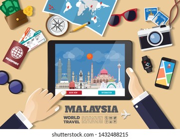 Hand holding smart tablet booking travel destination.Malaysia famous places.Vector concept banners in flat style with the set of traveling objects, accessories and tourism icon.