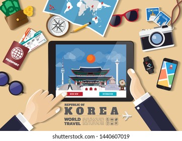 Hand holding smart tablet booking travel destination.South Korea famous places.Vector concept banners in flat style with the set of traveling objects, accessories and tourism icon.