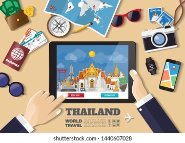Hand holding smart tablet booking travel destination.Thailand famous places.Vector concept banners in flat style with the set of traveling objects, accessories and tourism icon.
