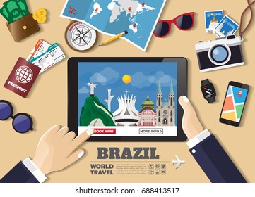 Hand holding smart tablet booking travel destination.Brazil famous places.Vector concept banners in flat style with the set of traveling objects, accessories and tourism icons. world landmarks set
