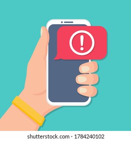 Hand holding smartphone with alert message notification in a flat design