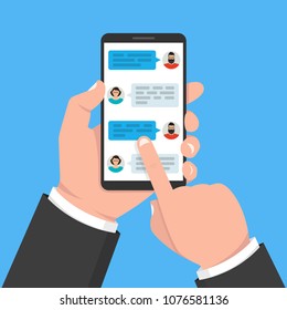 Hand holding smartphone with application with chat boxes. Vector illustration.