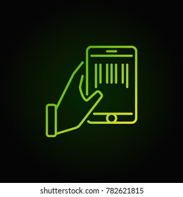Hand holding smartphone with a barcode inside outline green icon or sign on dark background