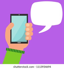 Hand holding smartphone with blank speech bubble for text.