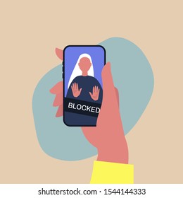 Hand holding a smartphone with a blocked user account, displayed on a screen, privacy in social media