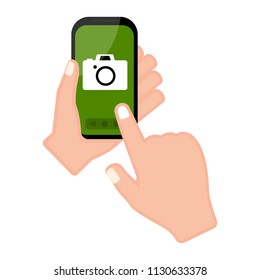 Hand holding a smartphone with a camera app
