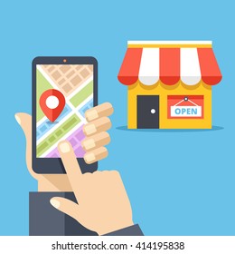 Hand holding smartphone with city map and store location on screen and store icon. Mobile navigation, gps navigator, route concepts. Flat design vector illustration isolated on red background