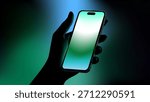 Hand Holding Smartphone with Cool Teal - Green Neon Glow on Futuristic Gradient Background