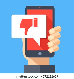 Hand holding smartphone with dislike message, dislike button. Thumbs down icon. Social networking, social media usage on mobile device. Concept for website, web banner. Flat design vector illustration