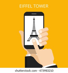 Hand holding smartphone with Eiffel Tower on the screen. Vector flat illustration.