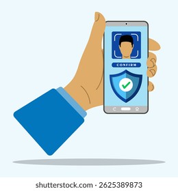 A hand holding smartphone with face recognition confirmation on screen. Face recognition and data safety concept. Login to device after biometrical check. Biometric identification and face ID system. 