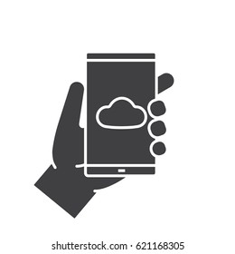 Hand holding smartphone glyph icon. Silhouette symbol. Smart phone cloud storage app. Negative space. Vector isolated illustration