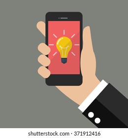 Hand holding smartphone with Light Bulb on display. Flat style design