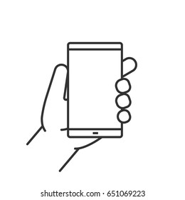 Hand holding smartphone linear icon. Thin line illustration. Contour symbol. Vector isolated outline drawing