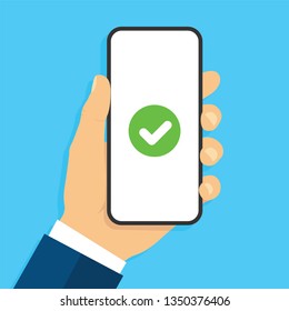 Hand holding smartphone with сheck mark. Success concept. Flat 
