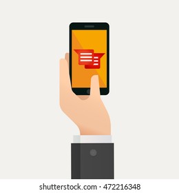Hand holding smartphone with message icon