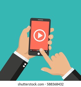 Hand holding Smartphone or Mobile phone with with video player on the screen. Movie app concept. Vector flat illustration - stock vector