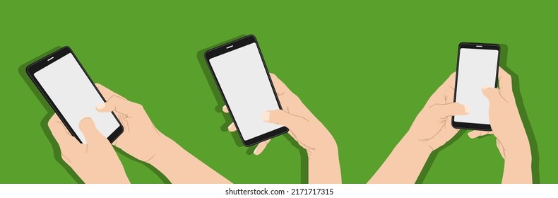 Hand holding smartphone on green background