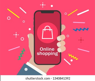 hand holding smartphone and online shopping on pink background.online shopping concept