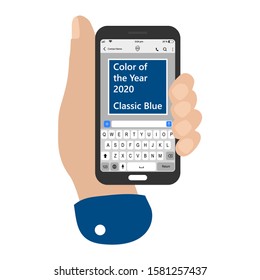 Hand holding smartphone with received message that trendy pantone Classic Blue color of the year 2020. Phone chat composer. 