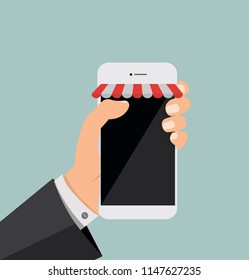 hand holding smartphone with shop online
