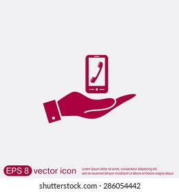 hand holding a smartphone with the symbol telephone handset