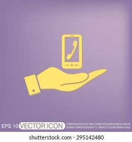 hand holding a smartphone with the symbol telephone handset