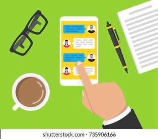 Hand holding smartphone with text messaging on the screen. ?up of coffee, notebook with pen and glasses lay on the table. Vector illustration.