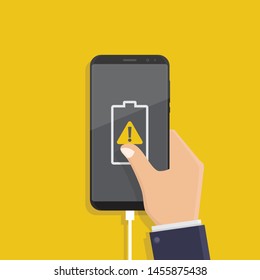 Hand holding smartphone that is being charging on yellow background, low or damaged battery notification, flat design vector illustration