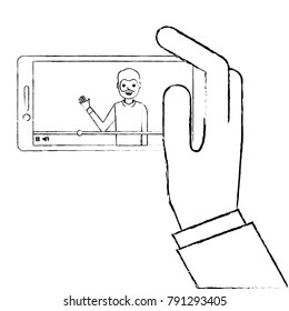 hand holding smartphone with video blogger on screen