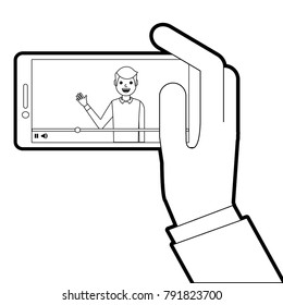 hand holding smartphone with video blogger on screen