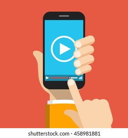 Hand holding smartphone with video player on the screen. Movie app concept. Vector flat illustration.