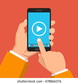 Hand holding smartphone with video player on the screen. Movie app concept. Vector flat illustration.