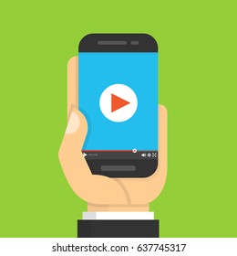 Hand holding smartphone with video player on the screen. Movie app concept. Flat cartoon style. Vector illustration.