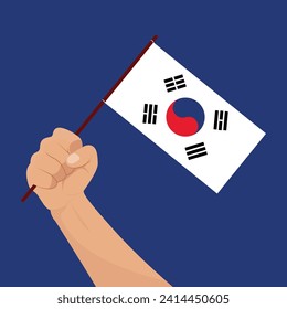 Mano sosteniendo la bandera de Corea del Sur